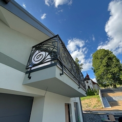 Designer wrought iron railing on the balcony of a family house