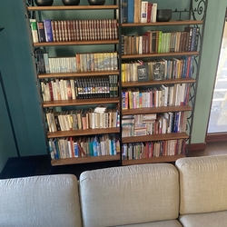 Forged bookshelf in the hall of a family house - wrought iron furniture