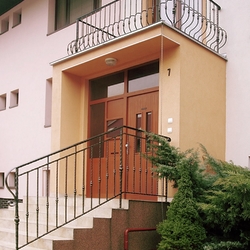 Forged balcony and staircase railing at a house entrance – exterior railings