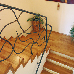 Hand wrought iron interior staircase railing 