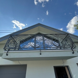 Modern balcony railing made according to the design by Ing. arch. Jozef Figlr