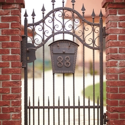 Forged gate with a mailbox with house number