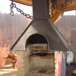 A wrought iron fireplace set 