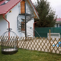 A spiral wrought iron railing 