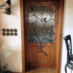 Artistic wrought iron grille in the shape of oak branch