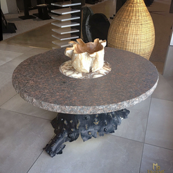 An exclusive wrought iron table of a tree bark design An exclusive wrought iron table of a tree bark design