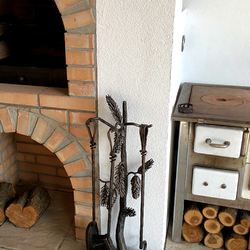 Exceptional fireplace tools with the design of nature at the outdoor fireplace
