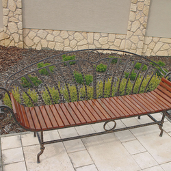 A wrought-iron garden bench in a combination with wood for your comfort
