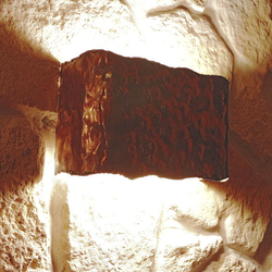 A lamp of an embossed copper with historical design in a family villa cellar