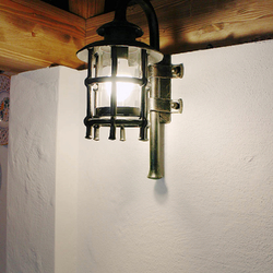 A hand wrought iron lamp in the summer kitchen - luxury lamp