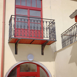 A cast iron railing in a historical house from the 16th century