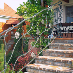 A wrought iron railing - sunflower