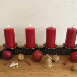 A forged Christmas candle holder suitable for both modern and folk style interior