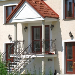 A wrought iron railing - garden stairs