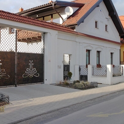 A wrought iron fence - metal and wrought iron combination