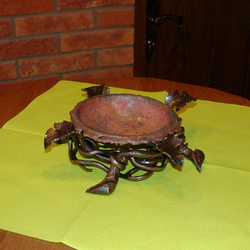 A copper wrought iron ashtray