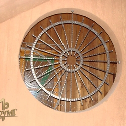 A wrought iron grille - wheel