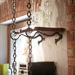 A wrought iron cellar shelf