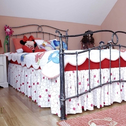 A wrought iron bed - a children's room - romantic forged furniture
