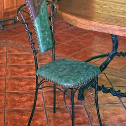 Luxurious leather on a wrought iron chair Luxurious leather on a wrought iron chair