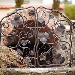 Forged luxury gate at the entrance to the wine cellar - artistic gate hand forged and shaped as a vine