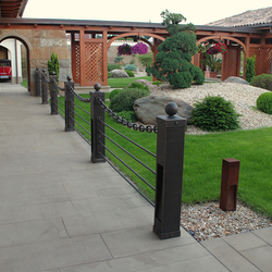 Modern wrought iron railing with a chain