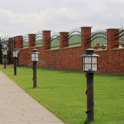 A walk down a lit garden - luxury wrought iron lamps