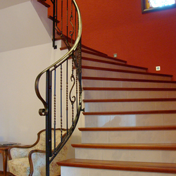 A spiral wrought iron stair railing