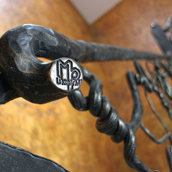 Hand wrought iron interior staircase railing - Roots - a detail
