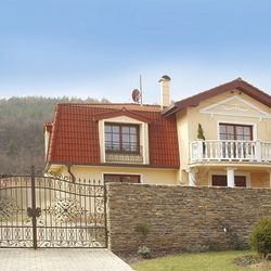 General view of the family house - forged gates and window grilles