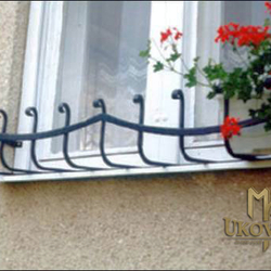 A wrought iron flower holder