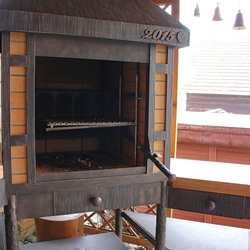 A wrought iron fireplace set