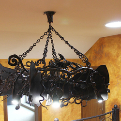 A wrought iron bat above a gallery