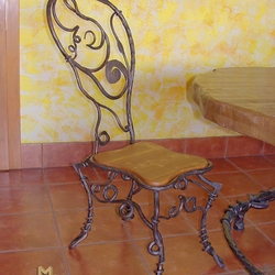 A wrought iron chair - A luxury chair