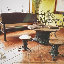 Wrought iron furniture in harmony with natural materials
