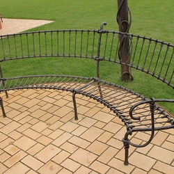 A wrought iron garden bench A wrought iron garden bench
