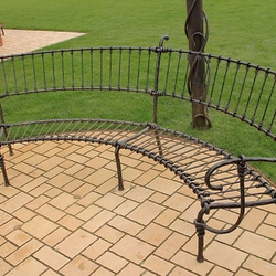 A wrought iron garden bench