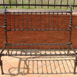 A wrought iron garden bench A wrought iron garden bench