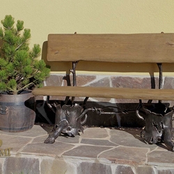 A wrought iron bench on a porch - luxury garden furniture A wrought iron bench on a porch - luxury garden furniture