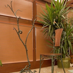 A wrought iron hanger - a branch A wrought iron hanger - a branch
