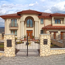 A wrought iron fence and gate