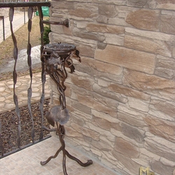 A wrought iron ashtray