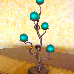 A wrought iron candleholder - a Romantic