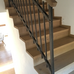 Forged interior staircase railing – simple railing with a wooden handle