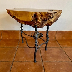 Designer table with a vine motif in the wine cellar  luxury furniture