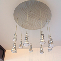  A modern stainless steel chandelier with spirals – A pendant lighting for your interior