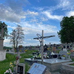 Monument with a book created in memory of two priests