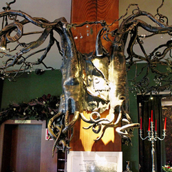 A wrought iron chandelier- roots - Hotel Galileo reception - Donovaly