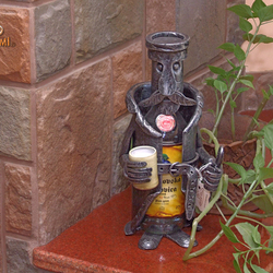 A wrought iron bottle holder - A Steward