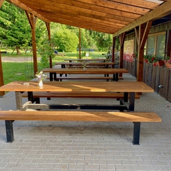 Tables and benches in a folk style on the caf terrace